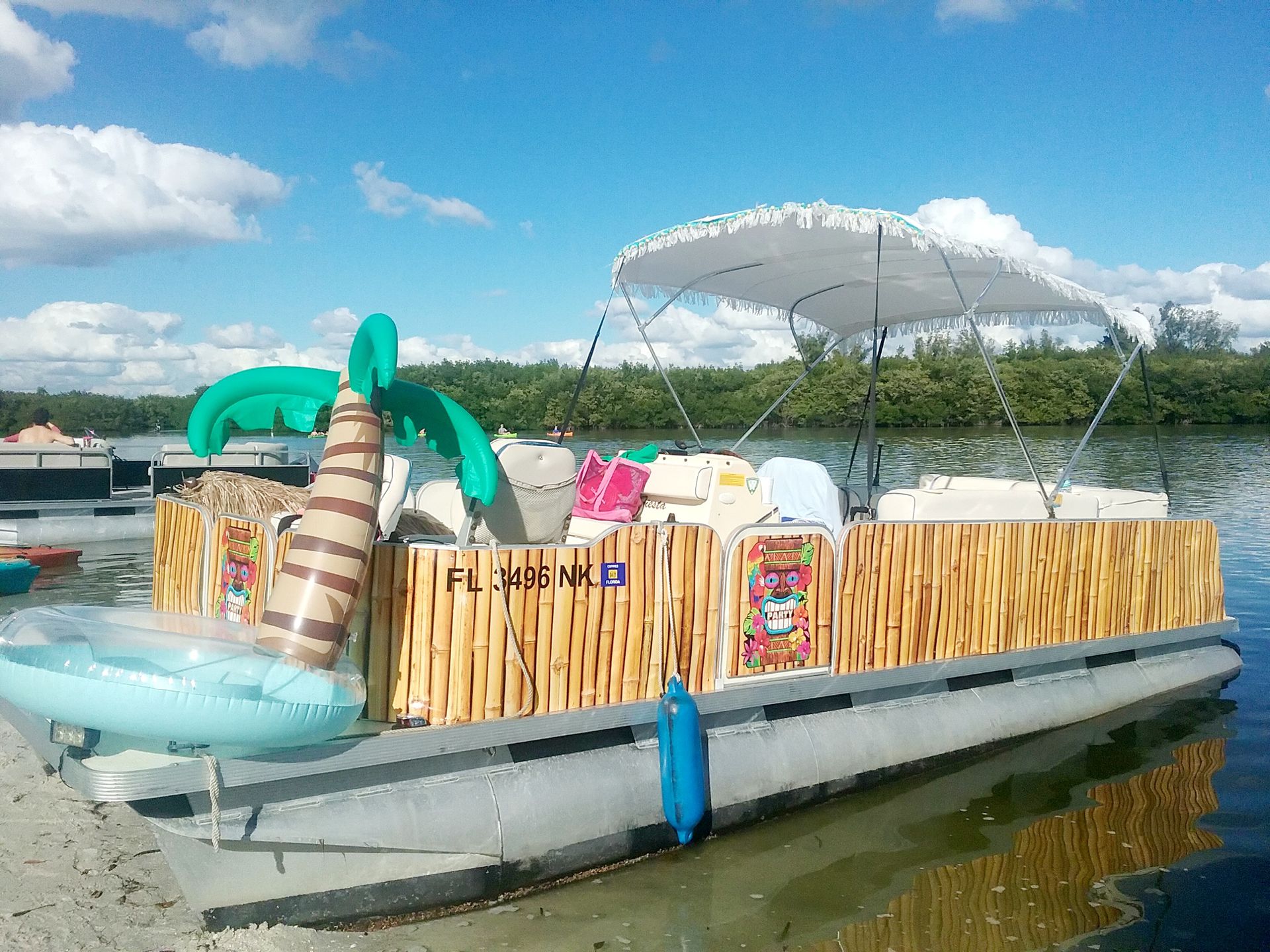 Tiki Boat and Floats | Casey Key, FL